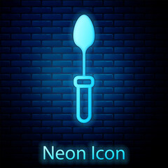 Wall Mural - Glowing neon Teaspoon icon isolated on brick wall background. Cooking utensil. Cutlery sign. Vector