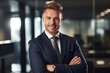 © altitudevisual - shot of a young manager looking cheerful while standing in an office