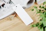 Fototapeta  - Cardboard bookmark with tassel mockup. 3D rendering