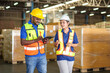 Worker using tablet check and control for workers with Modern Trade warehouse global business commerce concept