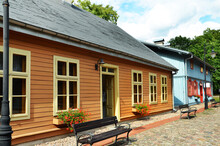 Restored Old Wooden Houses With Painted Doors And Window Frames