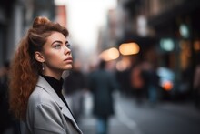Shot Of Young Woman Thinking About Something In A Busy Street
