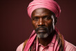 © gaukharyerk - Studio portrait of handsome elderly old african man on different colours background