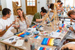 © Alfonso Soler - Painting Workshop. Friends having fun in painting class.