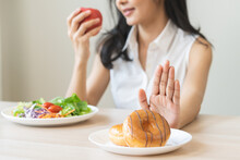 Diet, Dieting, Happy Asian Young Woman, Girl Hand Push Out, Deny Sweet Donut, Doughnut On Plate, Choose Red Apple And Green Vegetable Salad, Eat Food For Good Healthy, Female Getting Weight Loss.