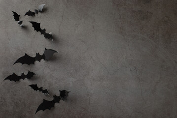 Wall Mural - Craft your Halloween wishes with this top view setup: themed decor, creepy bats on textured concrete backdrop, empty area available for text or advertising