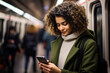 © photobuay - Candid Shot of a Woman Engrossed in Smartphone Work During Subway Journey. created with Generative AI
