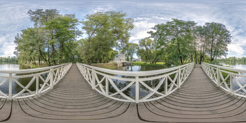 Wall Mural - full seamless spherical hdri 360 panorama view on wooden bridge over small river in forest in equirectangular projection, VR AR content.