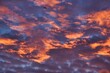 © Khun Ta - Tokyo, Japan - September 11, 2023: Illuminated clouds at sunrise in Tokyo