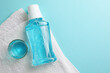 A mouthwash on a colored background. Dental care, dental health.
