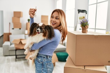 Sticker - Young caucasian woman smiling confident holding key and dog at new home