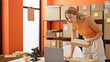 © Krakenimages.com - Young blonde woman ecommerce business worker using laptop holding package celebrating at office