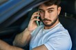 © Krakenimages.com - Young hispanic man talking on smartphone sitting on car at street