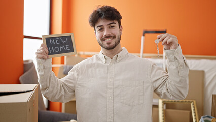 Sticker - Young hispanic man smiling confident holding new house keys and blackboard at new home