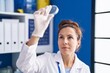 © Krakenimages.com - Young woman scientist looking sample working at laboratory
