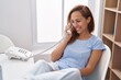 © Krakenimages.com - Young woman smiling confident teleworking at home