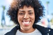 © Krakenimages.com - African american woman smiling confident standing at street