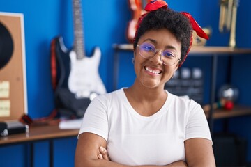 Sticker - African american woman musician smiling confident sitting with arms crossed gesture at music studio