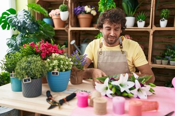 Sticker - Young hispanic man florist make bouquet of flowers at flower shop