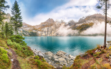 Wall Mural - incredible autumn view of oeschinensee lake.