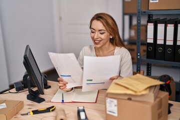 Canvas Print - Young woman ecommerce busines worker reading document working at office