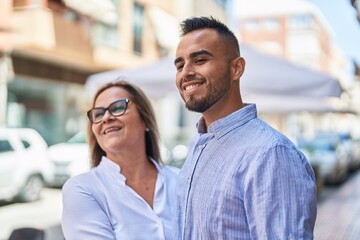 Canvas Print - Man and woman mother and daugther standing together at street