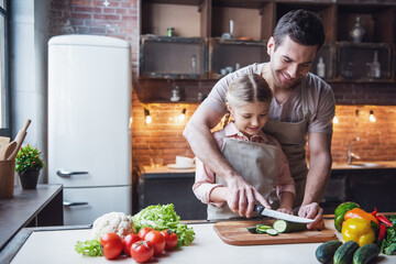 Wall Mural - Father and daughter cooking