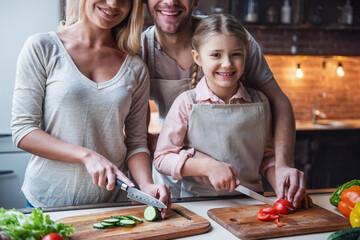 Wall Mural - Young family cooking