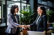 © AspctStyle - Happy middle aged business woman meets its client and shakes hands in a modern office. Smiling female executive manager shaking hands with client before meeting in start up office