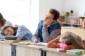 Poster - Tired sleepy classmates sitting at desks in classroom