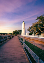 Ocracoke Lighthouse On Ocracoke Island , North Carolina At Sunset.The Lighthouse Was Built To Help Guide Ships Through Ocracoke Inlet Into Pamlico Sound.
