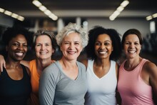 Smiling Portrait Of A Group Of Middle Aged Women In Sports Clothes In A Gym
