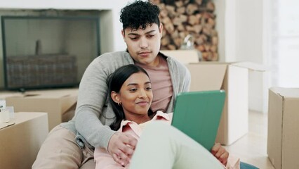 Wall Mural - Couple, tablet and boxes for new home planning, social media and website information of mortgage, rent or loan. Young interracial people, relax on floor and digital, moving house or real estate idea