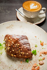 Wall Mural - fresh croissant with cup of cappuccino