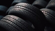 New tires pile on a dark background. Tire fitting background. stack of car tires.