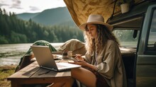 Young Woman Digital Nomad Engaging In Remote Work Outside Her Vintage Camper Van