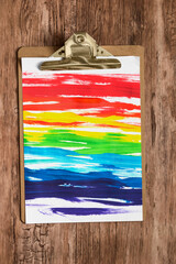 Sticker - Drawing clip board on wooden background