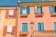 Caorle Venice, Italy - September 4, 2023: Colorful facade with windows and terrace