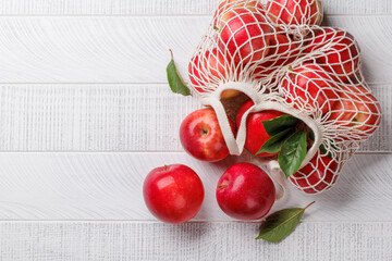Wall Mural - Mesh bag with fresh red apples