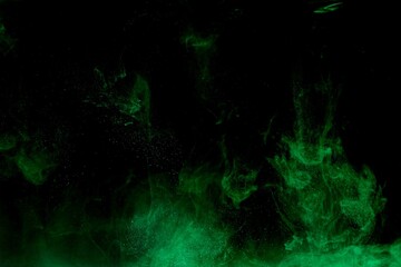 Wall Mural - Green colorful dye on black background,Art abstract smoke texture,Colored liquid dye,Splash paint,Abstract color,Abstract Textures