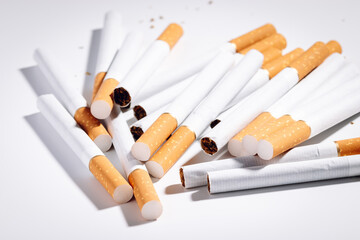 Pile of cigarettes on a white background. No smoking concept