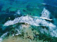 Blue Green Ocean Water With Waves Incoming To Shore - Aerial Overhead View