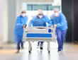 © Rethea Boer/peopleimages.com - Running, bed and surgeon team, healthcare expert or group speed for surgery support, emergency services or medical help. Wellness, fast motion blur and doctors rush patient for first aid teamwork
