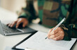 © aLListar/peopleimages.com - Sign, military or hands writing on application or contract, form document for war counselling. Laptop, survey checklist or soldier with history on paperwork or notes for legal agreement or note