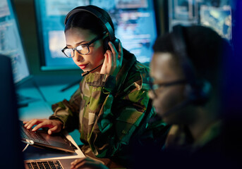 military control room, headset and woman with communication, computer and technology. security, glob