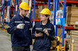 © FotoArtist - Warehouse workers checking the inventory. Products on inventory shelves storage. Worker Doing Inventory in Warehouse. Dispatcher in uniform making inventory in storehouse. supply chain concept