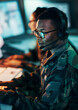 Military, call center and man on computer in office, data center and monitor for technical support, cybersecurity or surveillance. Army, officer and work in tech, security or government communication