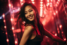 Portrait Of An Asian Woman Dancing In The Nightclub. Party And Concert Advertising Campaign Background.