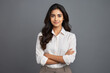 © PRASANNAPIX - young and confident woman standing with arm crossed.