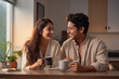 © PRASANNAPIX - Young couple taking tea or coffee together at home